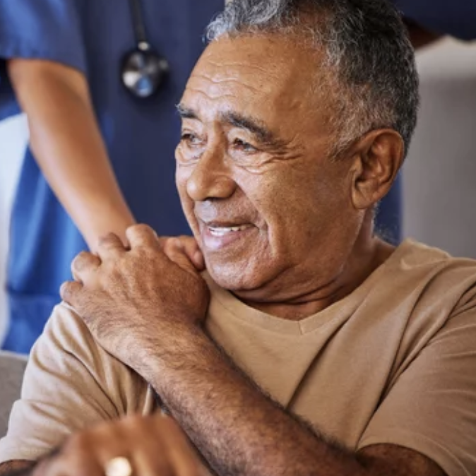 Diverse group of caregivers and residents at Aurem Care embracing individuality and inclusivity in a supportive care home environment